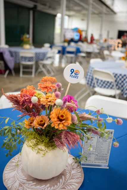 Floral centerpiece featuring the United Way of Greater Kingsport 90th anniversary logo at the organization's anniversary celebration.