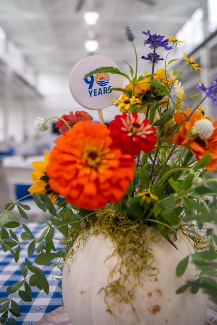 Floral centerpiece displaying the 90th anniversary logo at the United Way of Greater Kingsport anniversary celebration.